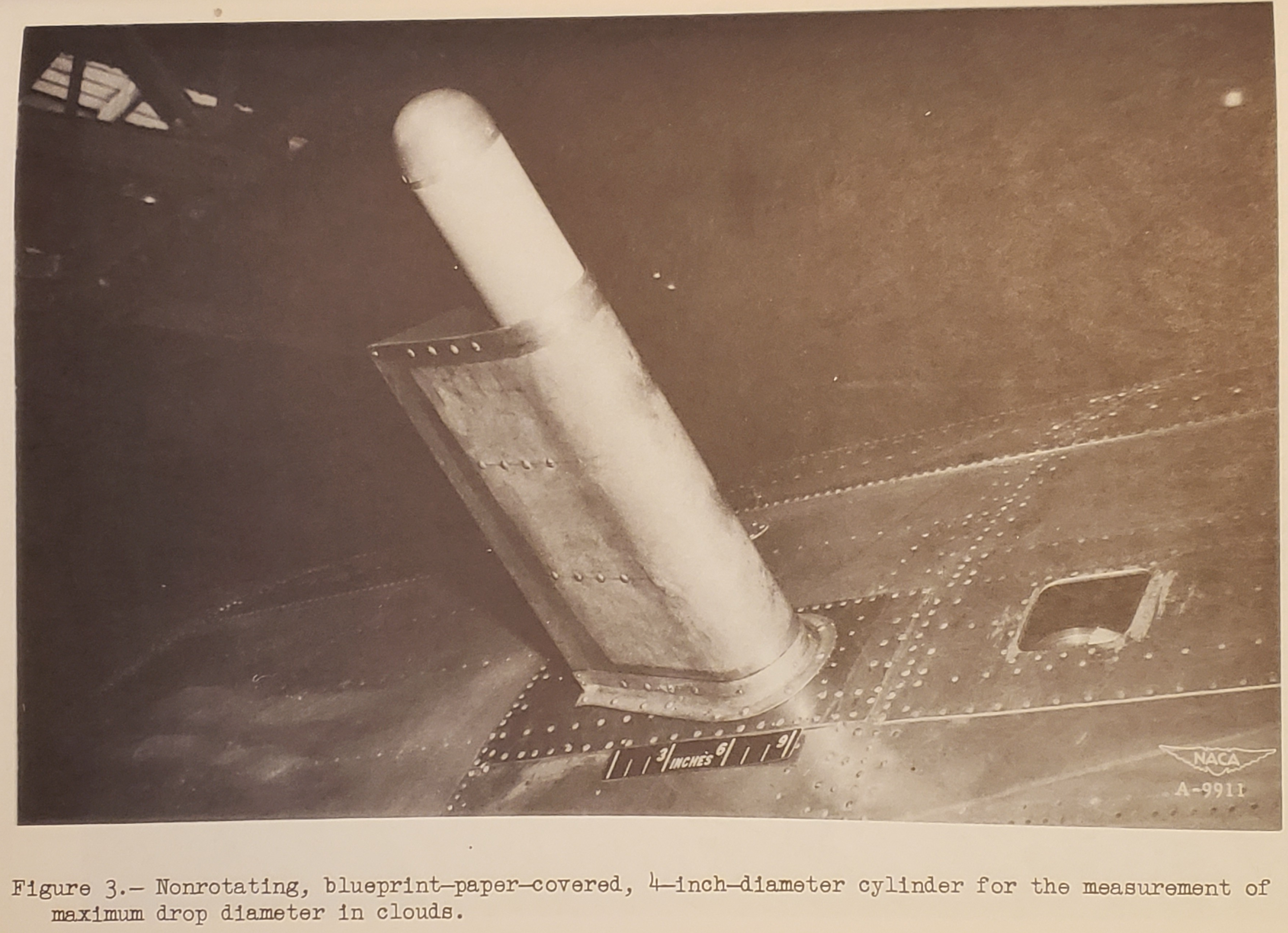 Figure 3. Nonrotating, blueprint-paper-covered, 4-inch-diameter cylinder for the measurement of maximum drop diameter in clouds.